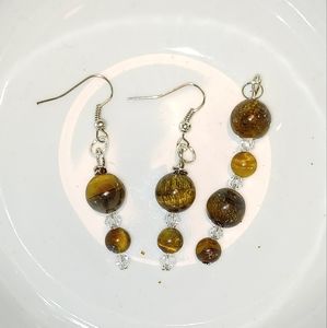 A pair of tiger eye earrings with a pendant as a bonus.